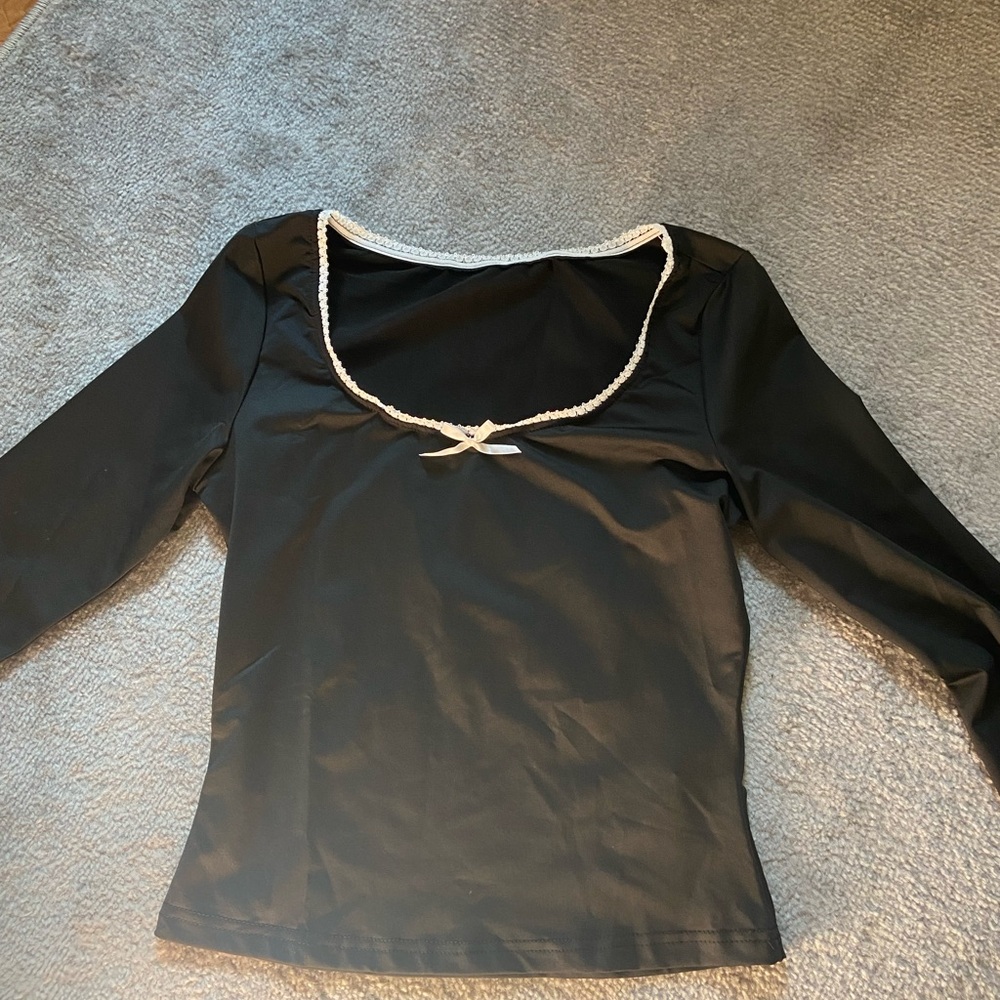 Elegant Black Top with White Trim